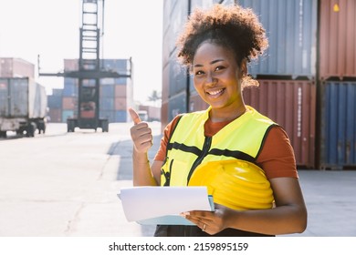 Happy African Women Worker In Port Cargo Shipping Industry Standing Smile.