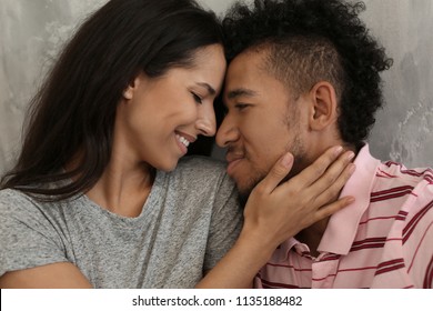 Happy African-American couple indoors