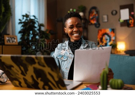 Happy afro american black woman with short hait wearing casual fashionable clothes denim jacket having job interview online with employer applying for new interesting part time job.