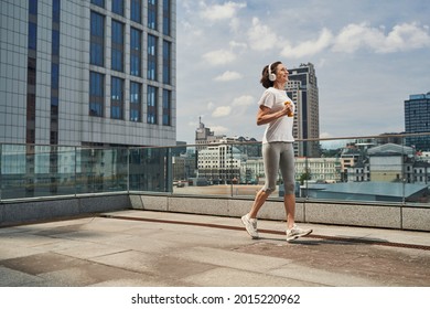 Happy Aged Female Ding Cardio Training Outdoors