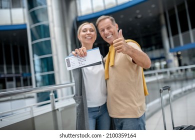 Happy Airline Passengers Posing For The Camera