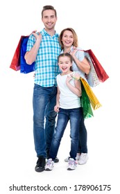 Happy American Family With Child Holding Shopping Bags - Over White Background