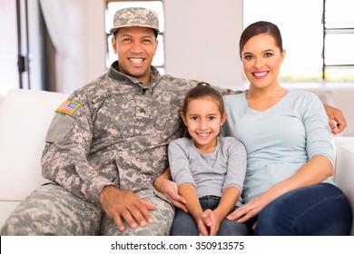 Happy American Military Family Relaxing At Home