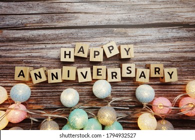 Happy Anniversary alphabet letter with LED Cotton ball Decoration on wooden background - Shutterstock ID 1794932527