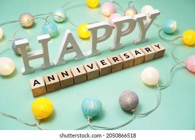 Happy Anniversary alphabet letter with LED cotton balls on green background - Shutterstock ID 2050866518