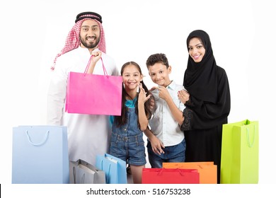 happy Arab family shopping