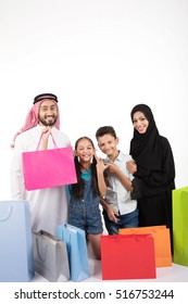 happy Arab family shopping