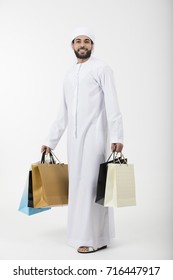 Happy Arab Man With A Shopping Bags Standing On White Background