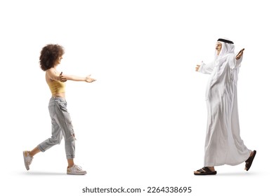 Happy arab man and a young casual woman walking towards each other with arms open isolated on white background