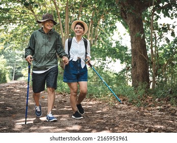 Happy Asia adult couple trekking in the wood	 - Powered by Shutterstock