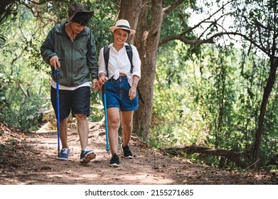 Happy Asian Adult Couple Trekking In The Wood	