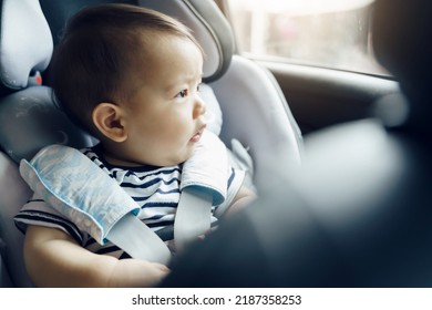 Happy Asian Baby Boy In The Car Seat, Little Toddler Travel By Car With Family.