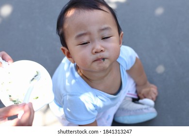 Happy Asian Baby Eating Mesh Rice And Vegetable And Making A Mess, Top View.