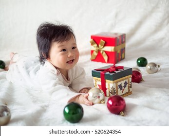 Happy Asian Baby Girl With Her Christmas Gift Box 