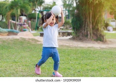 Happy Asian baby girl running or jumping and playing at the park or garden field. She smiling and laughing. Child aged 2-3 years old. Relaxation and exercise for health. Development of kid concept. - Powered by Shutterstock