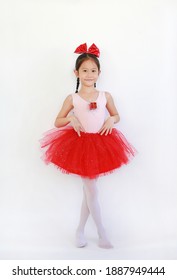 Happy Asian Ballet Dancer Girl In Pink-red Tutu Skirt Isolated On White Background.