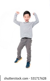 Happy Asian Boy With Hands Up And Smiling Isolated Over White Background