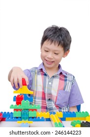 Happy Asian Boy Playing With Building Blocks 