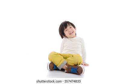 Happy Asian Boy Sitting On White Background Isolated