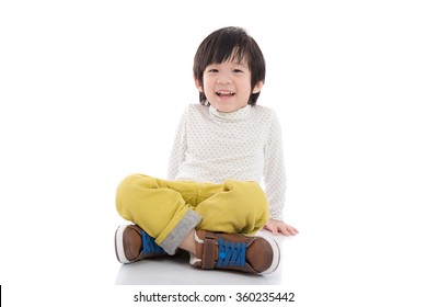 Happy Asian Boy Sitting On White Background Isolated