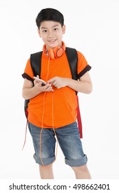 Happy Asian Boy Using Cell Phone On White Background .