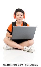 Happy Asian Boy Using Laptop On White Background .