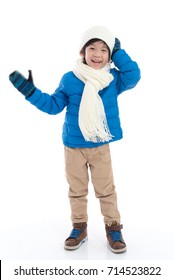 Happy Asian Child In  Blue Winter Clothes Standing On White Background Isolated