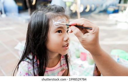 happy asian Child preschooler with face painting. Make up. - Powered by Shutterstock