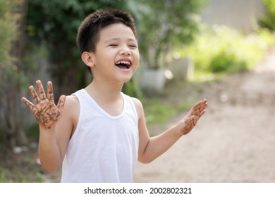 Happy Asian Children Playing Outside With Dirty Hands