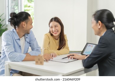 Happy Asian Couple Client, Tenant Buyer Home ,apartment, Sign Signature Contract Rental, Purchase. Landlord, Realtor Agreement After Bank Approve Mortgage, Loan Success Or Done. Property Agent Concept