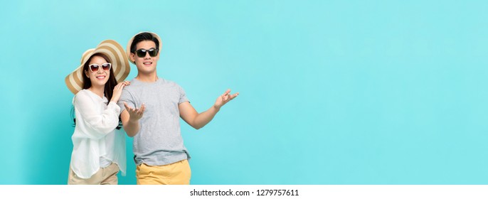 Happy Asian Couple In Summer Beach Casual Clothes Studio Shot Isolated On Light Blue Banner Background With Copy Space