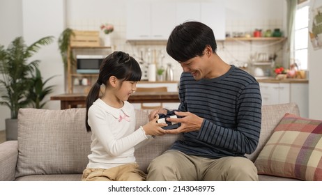 Happy Asian Dad Feel Surprised After Releasing Hand Covering Face And Seeing The Father’s Day Gift In The Living Room At Home