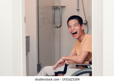 Happy Asian Disabled On Wheelchair Smiling With Happiness Face In Toilet, Real People Pictures Of Daily Life In The Home, Lifestyle Of Disability Kid Concept.