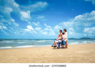 Happy Asian Diversity Generation Family Standing On Tropical Beach In Summer In Sunset