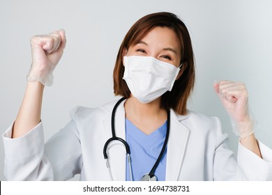 Happy Asian Doctor Wear The Medical Mask To Protect And Fight Infection From Germ, Bacteria, Covid19, Corona , Sars , Influenza Virus On White Background With The Happy Face.