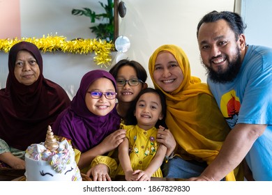 Happy Asian Extended Family Celebrating Birthday Together At Home.