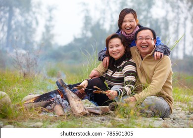 Happy Asian Family Camping Roast Outdoor