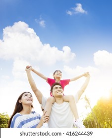 Happy Asian Family With Cloud Background