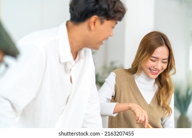 Happy Asian Family Couple Enjoy Cooking Pasta On Cooking Pan With Talking Together In The Kitchen At Home. Husband And Wife Having Dinner Party Celebration Eating Food Together On Holiday Vacation