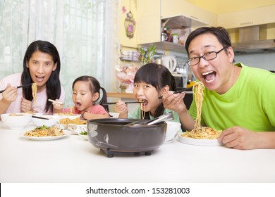 Happy Asian Family  Eating Noodles