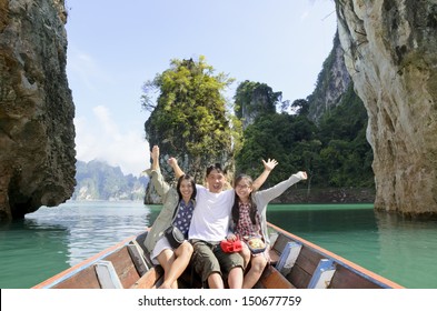 Happy Asian Family Enjoy A Cruise On A Holiday Adventure By Boat Trip, Tourist Fun The Nature Lake And Island In Summer, People Lifestyle Tourism In Vacation Travel Asia At Khao Sok Guilin Of Thailand