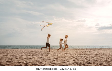 Happy asian family enjoy the sea beach. father, mother and daughter having fun playing beach in summer vacation on the ocean beach. Happy family with vacation time lifestyle concept. - Powered by Shutterstock