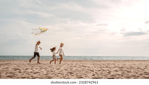 Happy asian family enjoy the sea beach. father, mother and daughter having fun playing beach in summer vacation on the ocean beach. Happy family with vacation time lifestyle concept. - Powered by Shutterstock