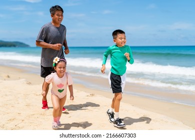 Happy Asian Family Grandfather Jogging Exercise With Little Grandchild Boy And Girl On Tropical Beach. Healthy Senior Man And Children Kid Enjoy Outdoor Activity Sport Training On Summer Vacation