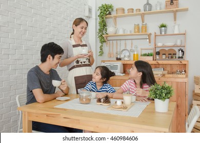 Happy Asian Family Have A Breakfast Together In The Morning