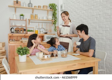 Happy Asian Family Have A Breakfast Together In The Morning