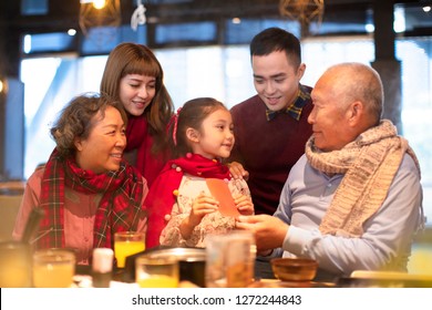 Happy Asian Family Having Dinner And Celebrating Chinese New Year
