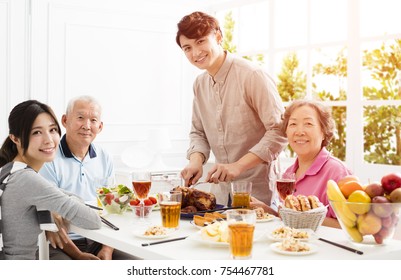 Happy Asian Family Having Dinner Together
