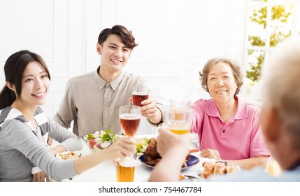 Happy Asian Family Having Dinner Together