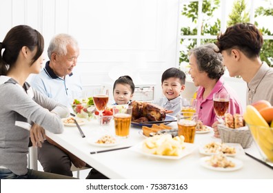 Happy Asian Family Having DinnerÂ at Home
